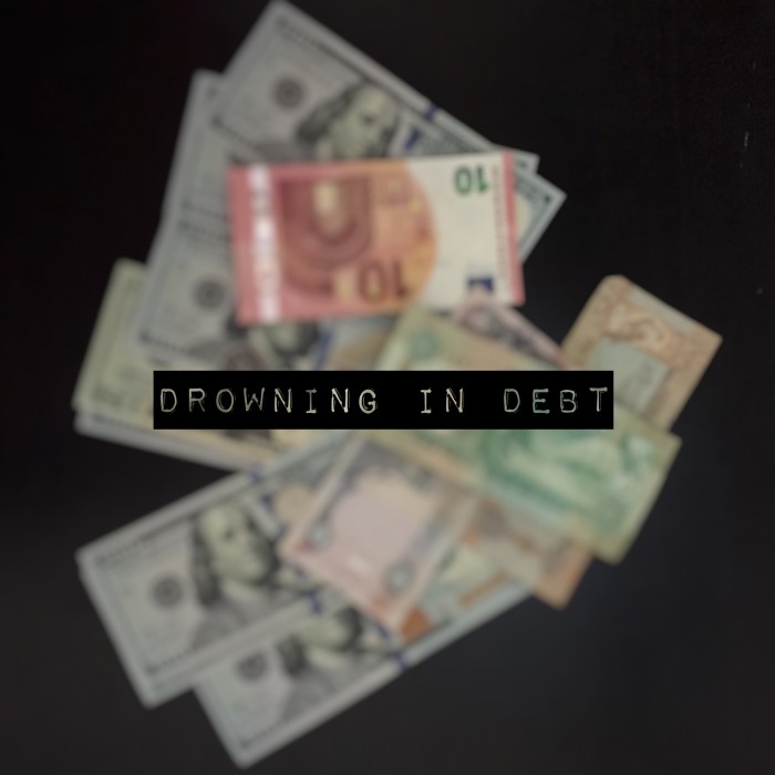 DROWNING IN DEBT